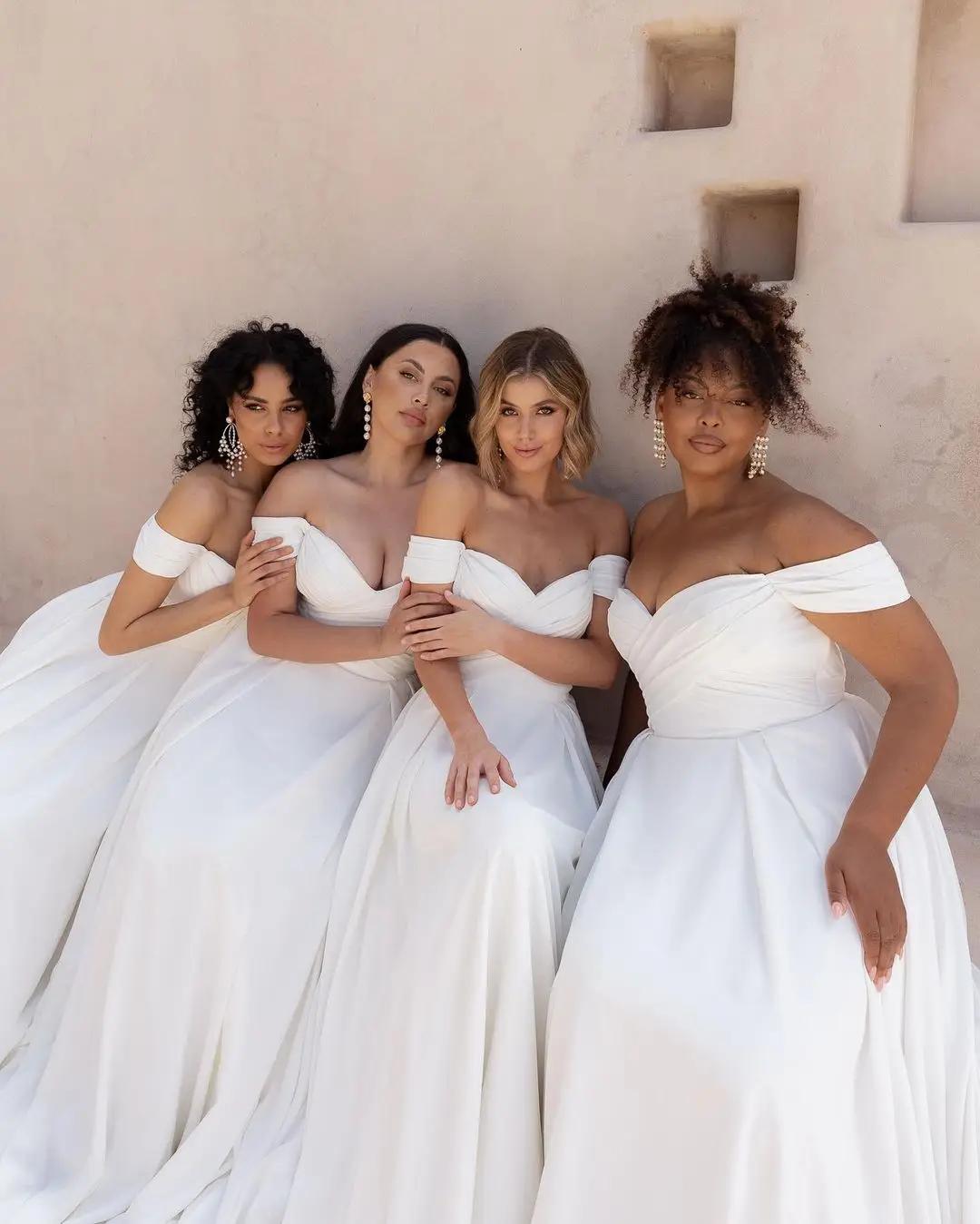 Models wearing multiple sizes of the same wedding dress