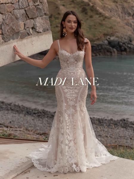 Model wearing a bridal gown by Madi Lane