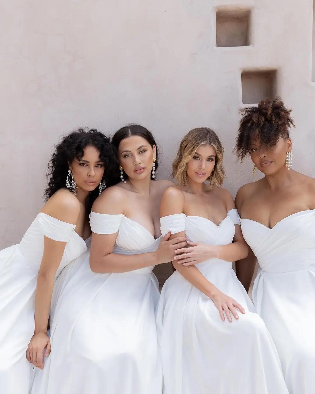 Models wearing multiple sizes of the same wedding dress